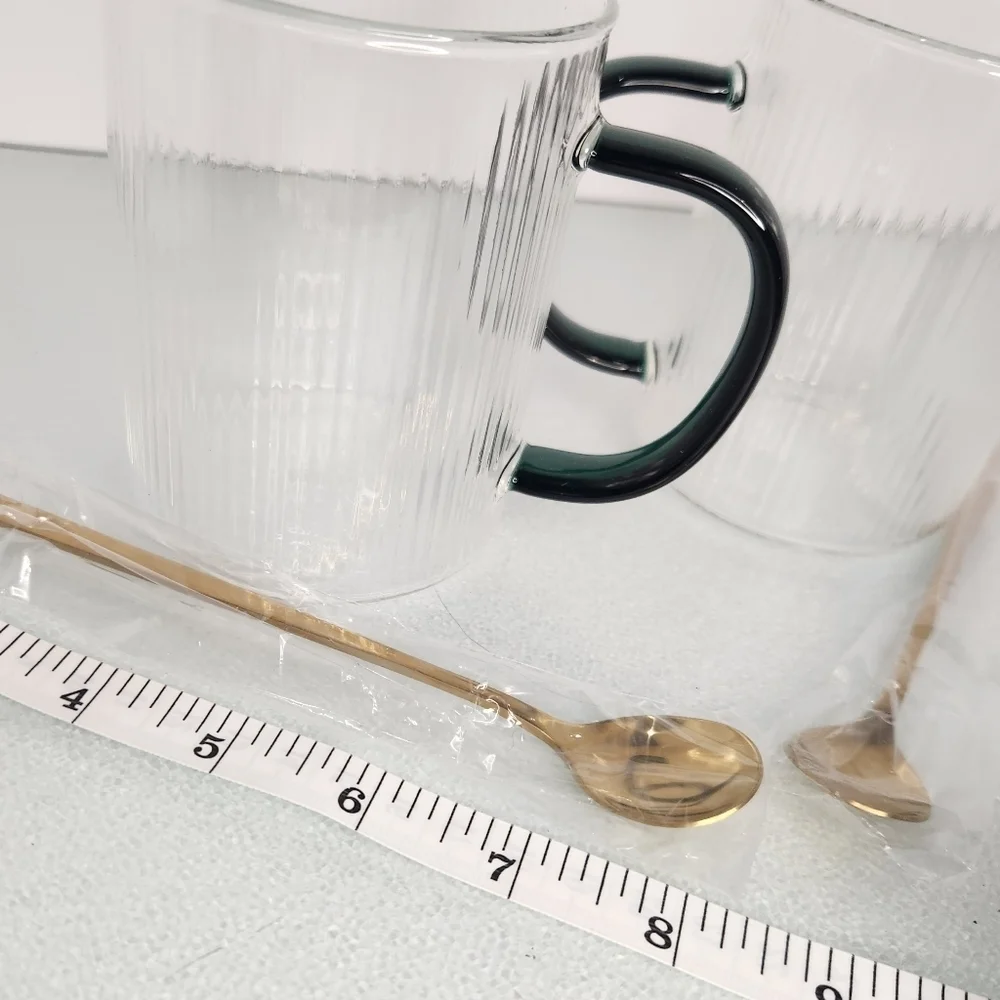 Lot 2 heat resistant clear and green‎ glass coffee/tea cups w gold stir spoons
